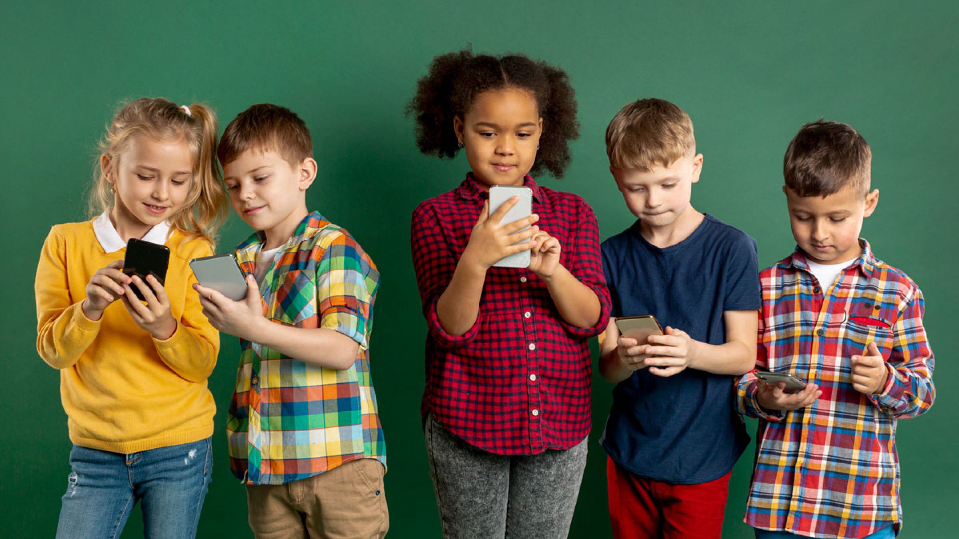 group of children using cell phones