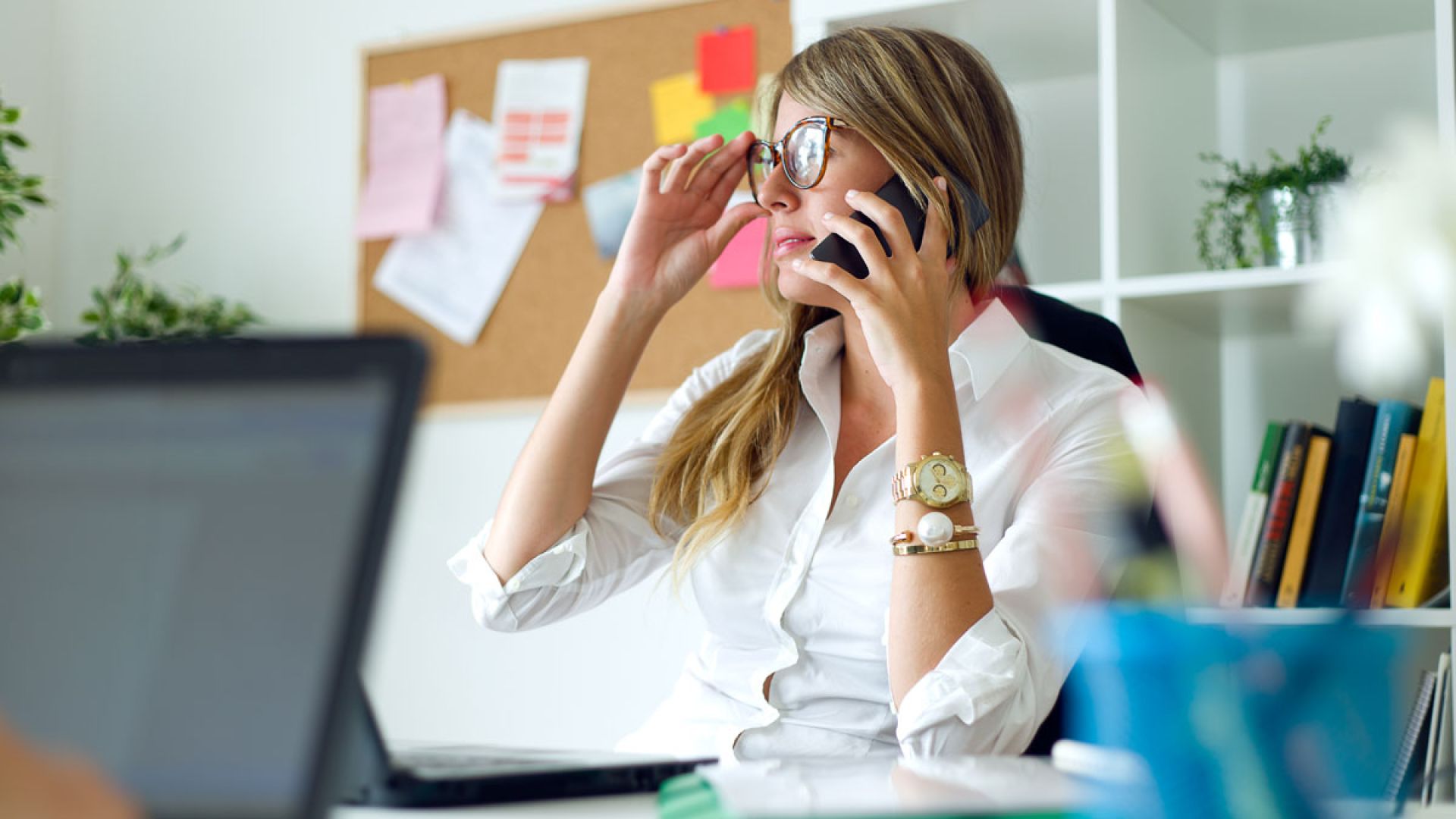 busy woman on the phone at desk
